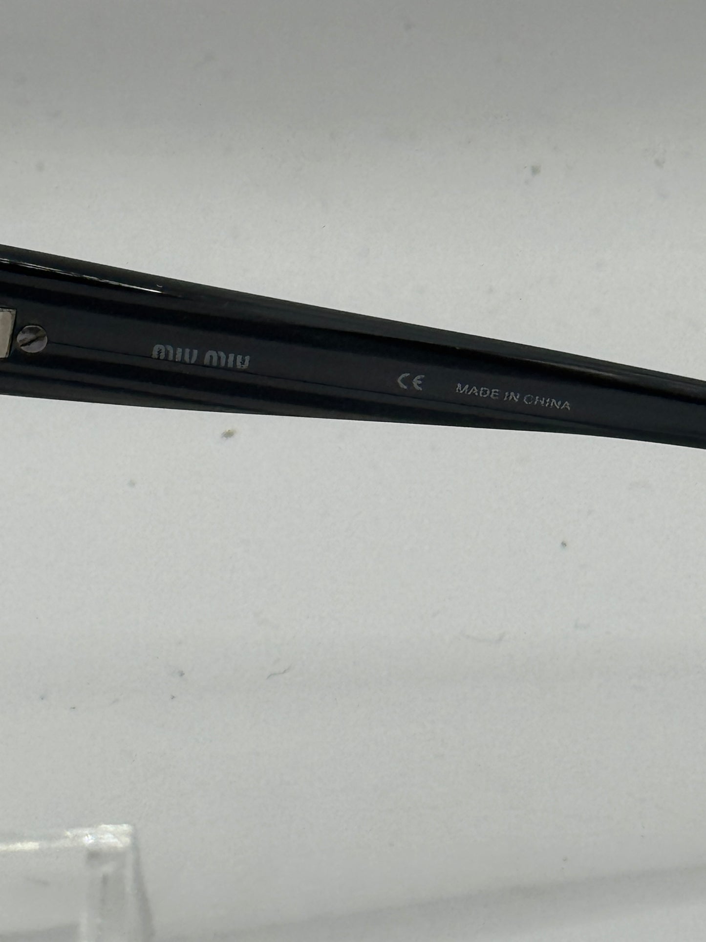 Miu Miu 61e Sunglasses in color 5av1a1