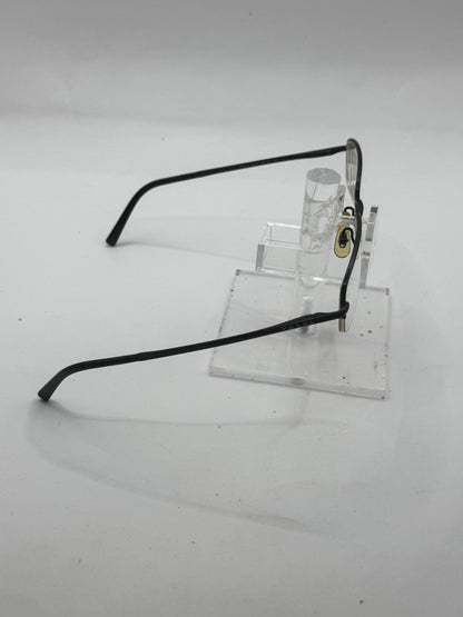 Prada Vpr57h Eyeglasses in color 1bo1o1