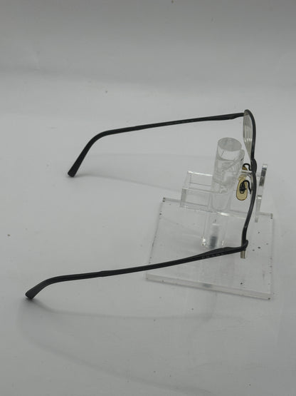 Prada Vpr57h Eyeglasses in color 1bo1o1
